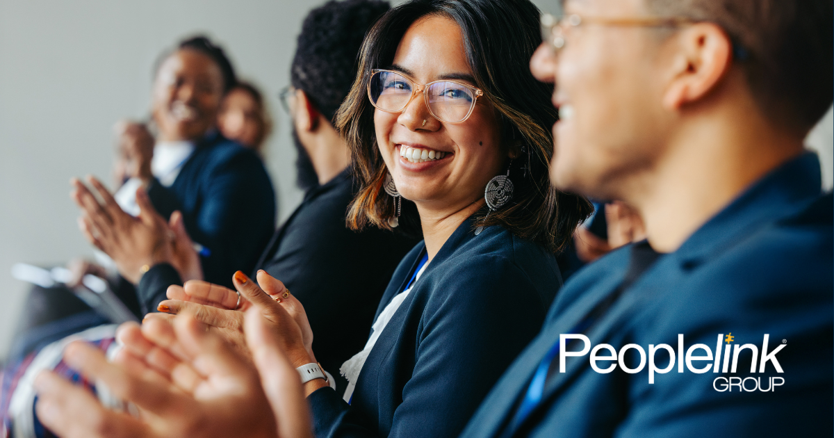 Happy employees applauding at a meeting
