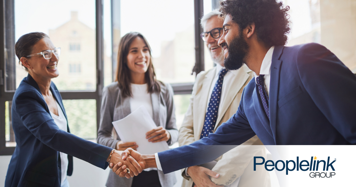 Candidate meeting with interviewers who will determine hiring green flags.